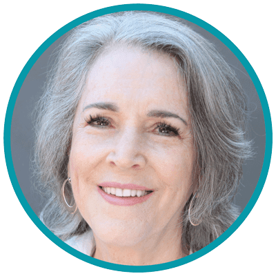 Headshot of Olivia Parr-Rud - a white woman with gray hair smiling